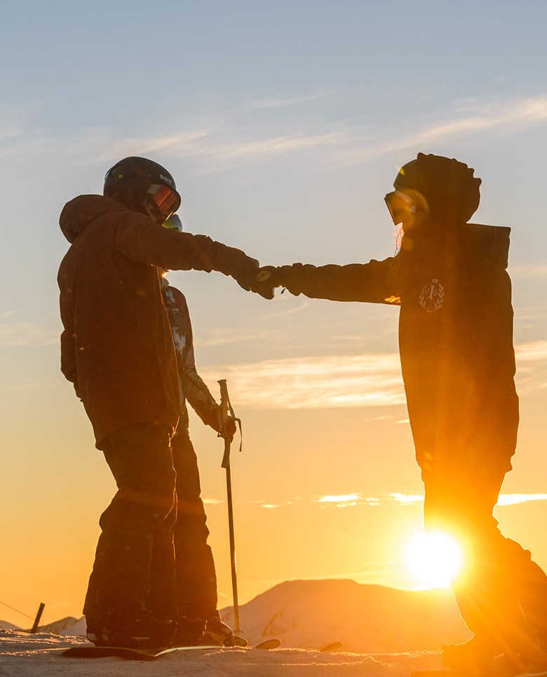 Fist bump at Coronet Peak, ski Queenstown