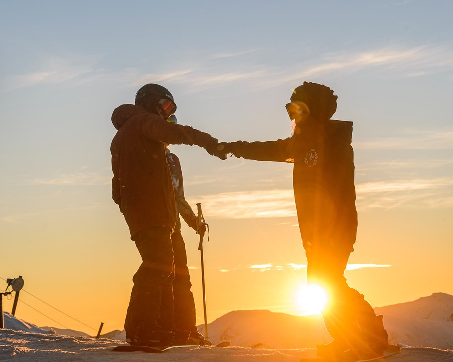 Fist bump at Coronet Peak, ski Queenstown